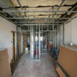 Interior construction with metal framing and drywall panels